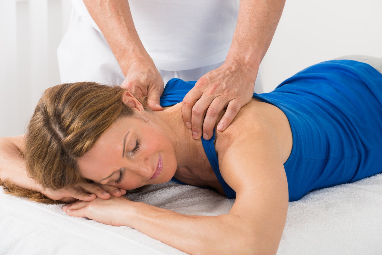 Person Giving Massage To Woman Workplace massage Holistic massage