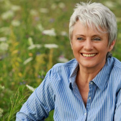 resizeCanva - Happy attractive senior woman in a flowerfield